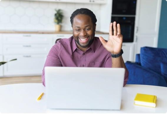 a person sitting at a table with the hands up