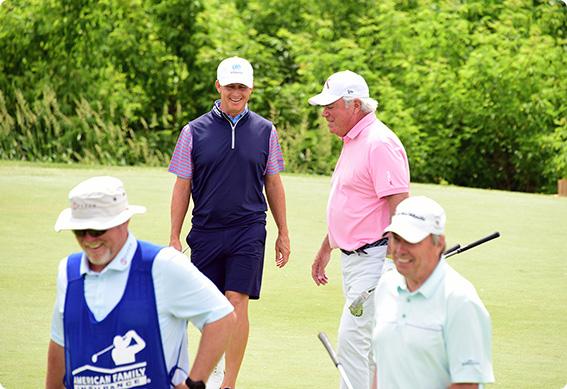 a group of men on a golf course