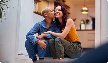 A couple sitting by an entry way