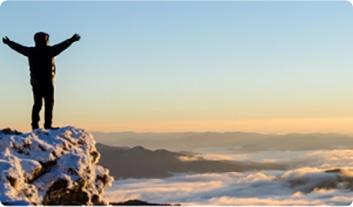 a man standing on a mountain