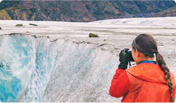 a person standing in front of a waterfall