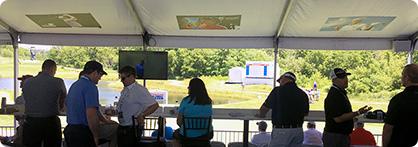 a group of people sitting under a tent