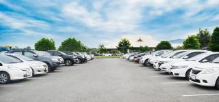 Multiple cars parked in a parking lot