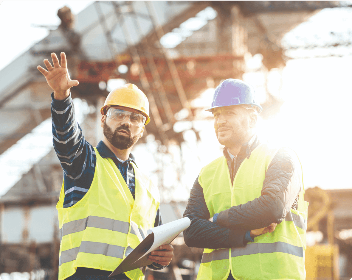 a man and woman in safety vests