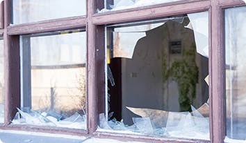 a broken window with a broken glass